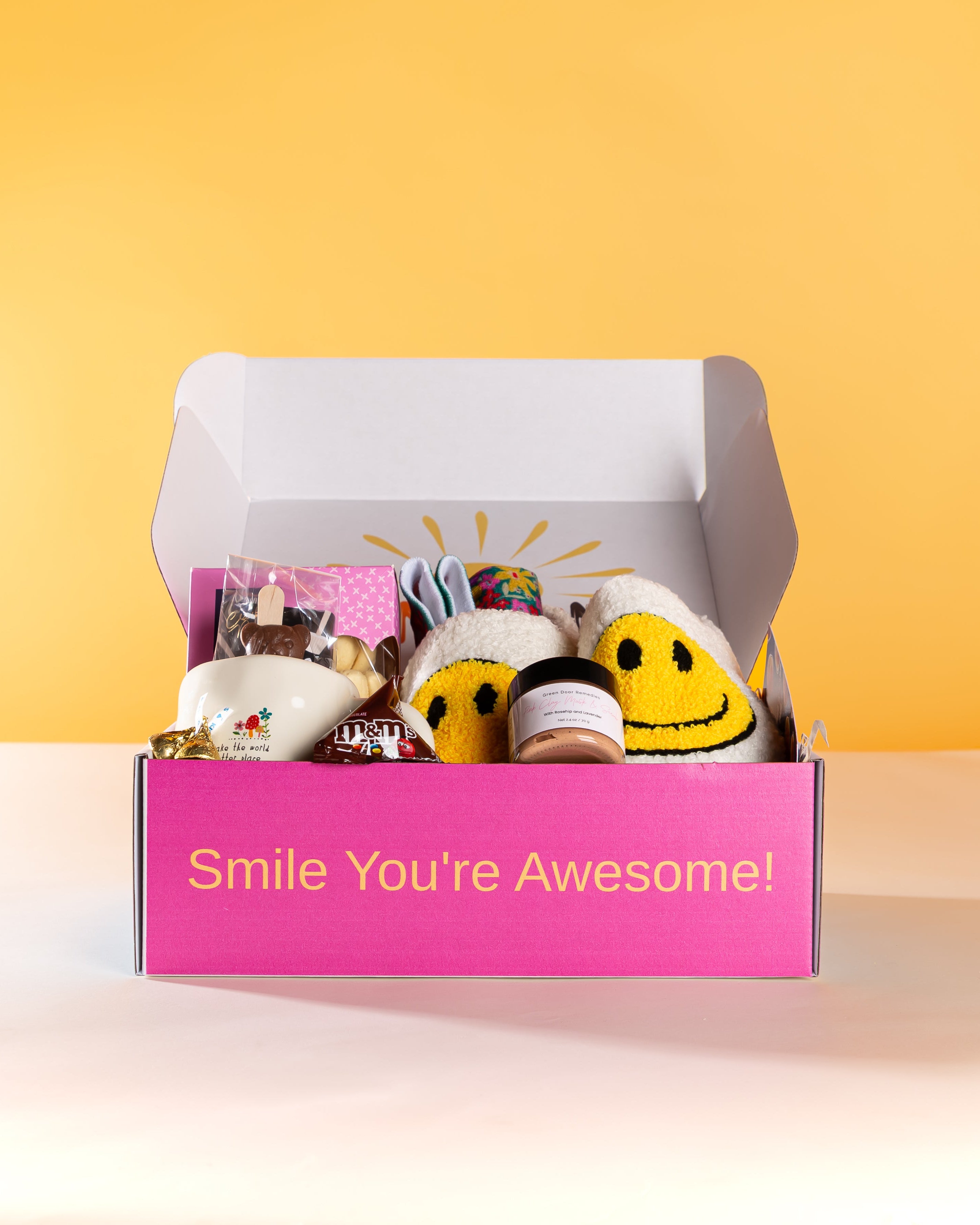 Warm Hugs Gift Box NZ – cosy slippers, warm socks, hot chocolate, treats, and personalised card, beautifully packaged for NZ-wide delivery, perfect for birthdays or pampering gifts.