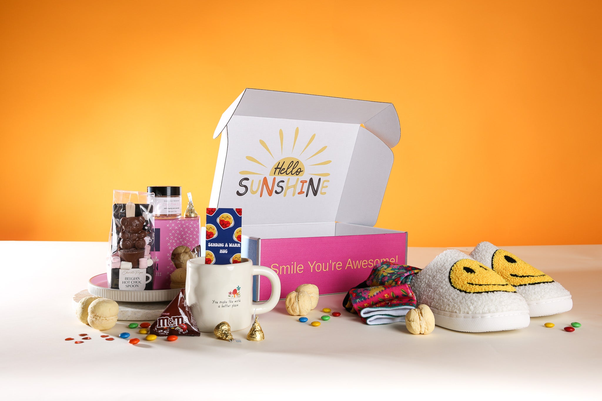 Warm Hugs Gift Box NZ – playful and thoughtful cosy gift box with slippers, socks, hot chocolate, treats, and personalised card, ideal for sending comfort across New Zealand.