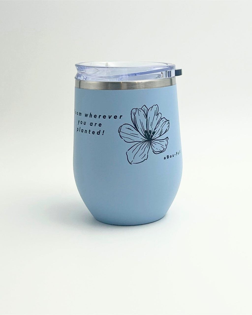 Baby blue Keep Cup with ‘Bloom Wherever You Are Planted’ print – ceramic-lined, insulated, and stainless steel outer. Perfect for coffee or tea lovers, ideal for gift boxes, thoughtful gifts, and wellbeing gifts NZ. Stylish, practical, and inspiring for daily use.