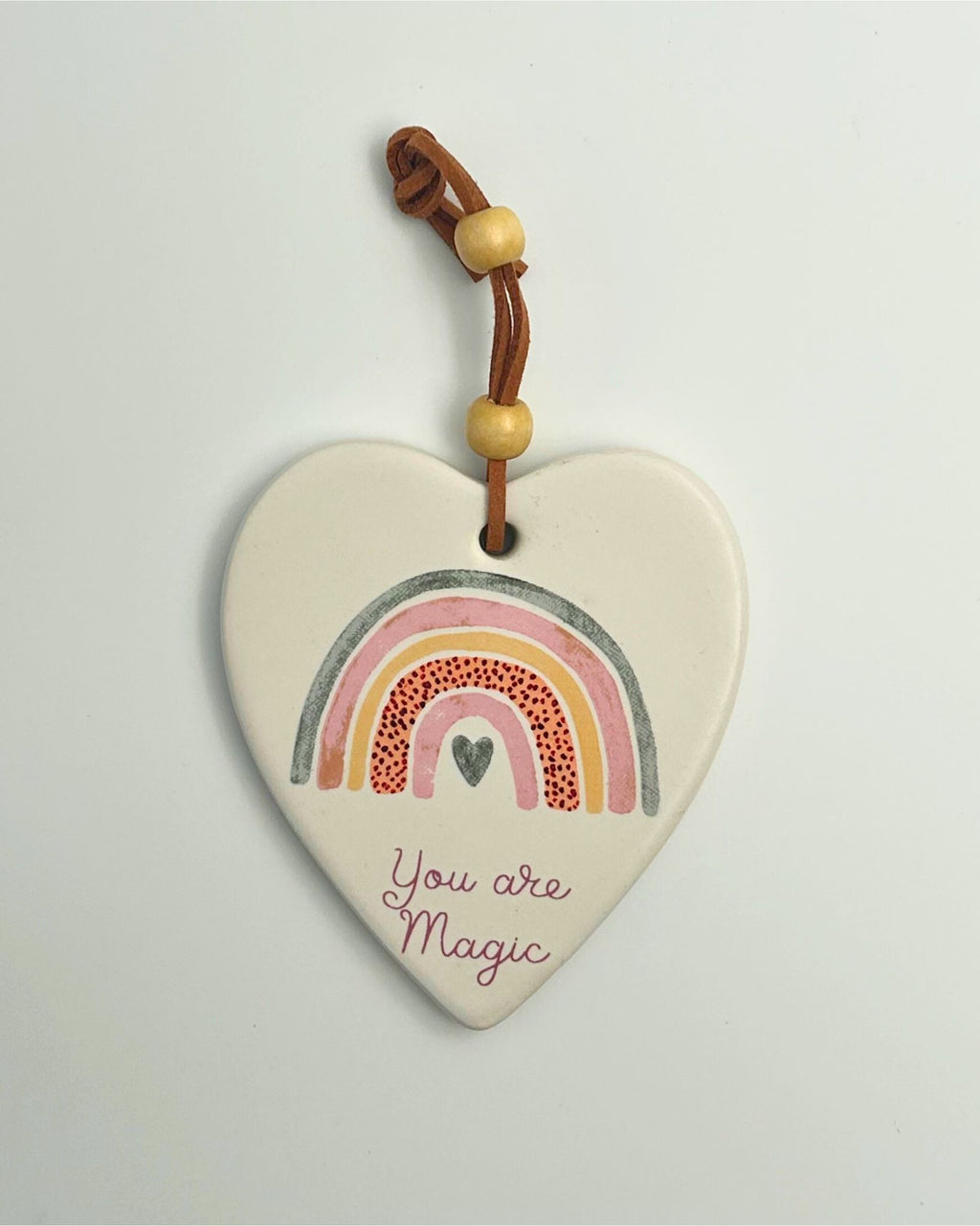 Heart-shaped ceramic ornament with rainbow and 'You are magic'
