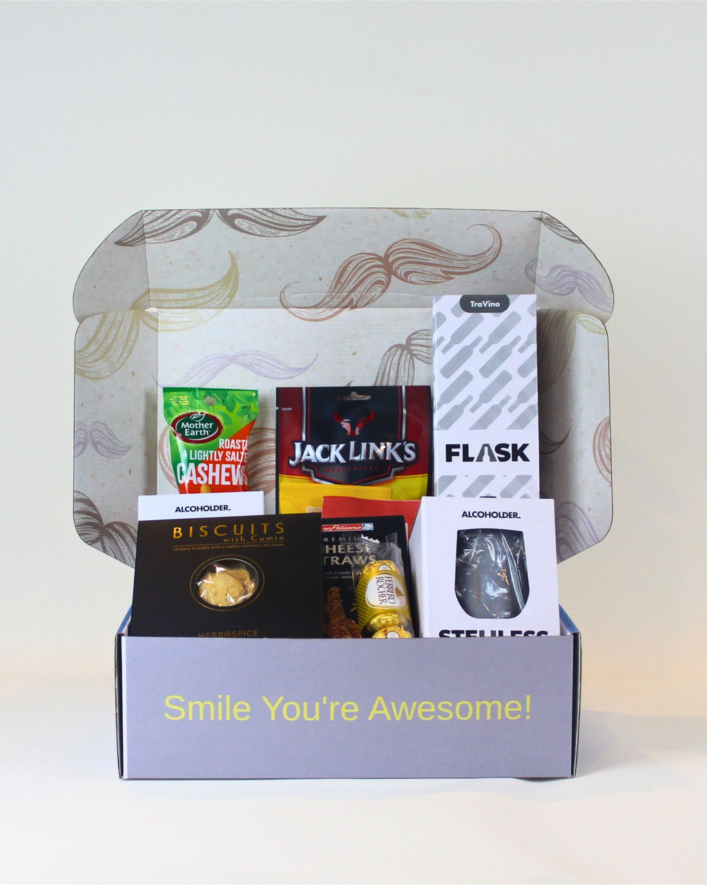 Gift box with snacks and a Flask on a light background