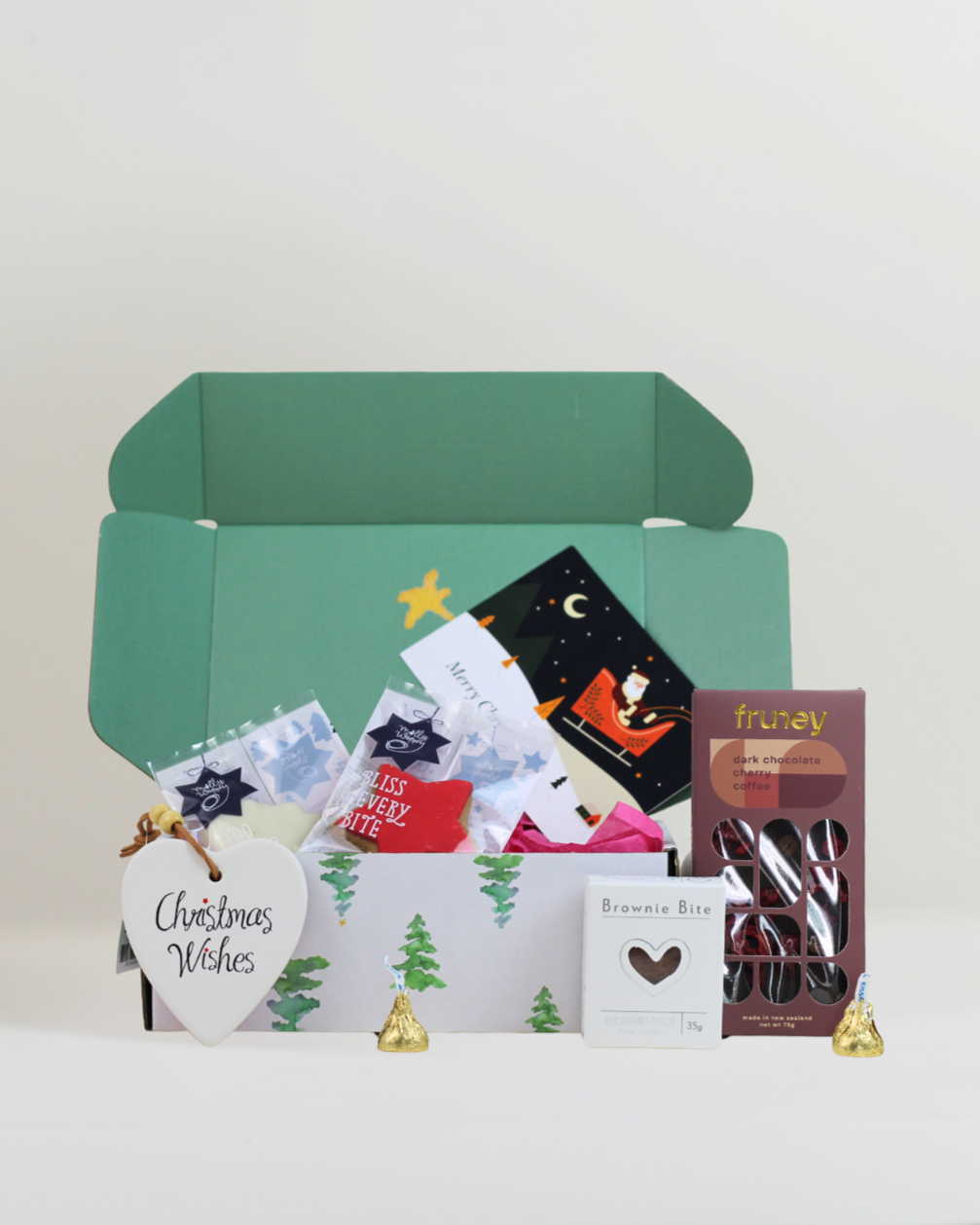 Christmas cheer, boxed up for $49.99. Festive Molly Woppy cookies, dark chocolate cherry & coffee chocolate, an indulgent brownie and a ceramic Christmas Wishes keepsake, all beautifully presented for Christmas.
