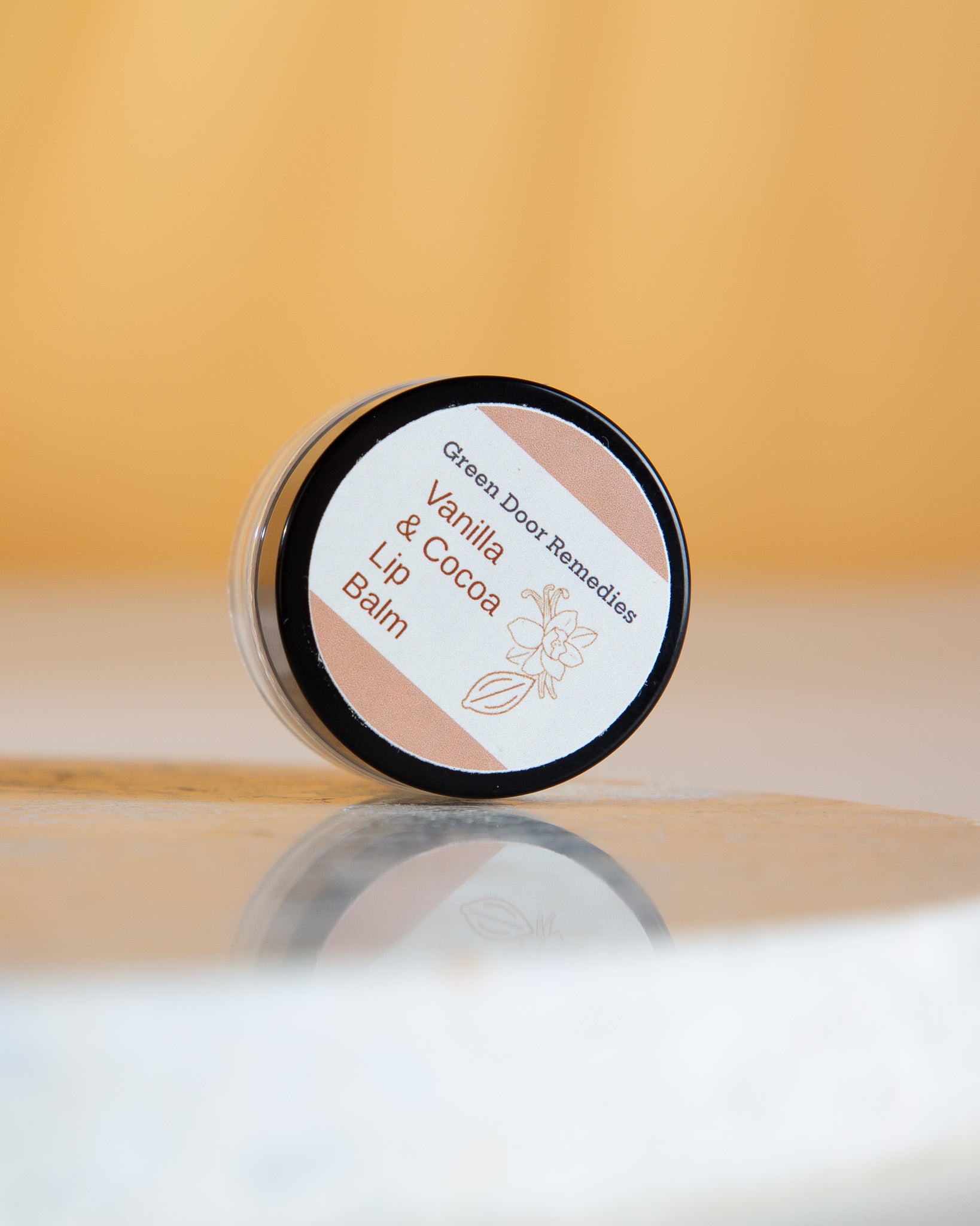 Cocoa & Vanilla Natural Lip Balm is made with nourishing natural ingredients to hydrate and protect lips, featuring a sweet vanilla scent and rich cocoa butter for soft, smooth lips.