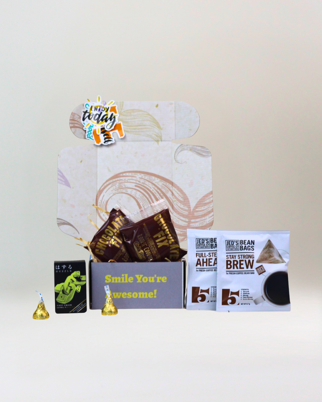 Coffee Break Box with Jed's coffee bean bags, Cookie Time cookies, Huzzle puzzle and Hershey's Kisses.

