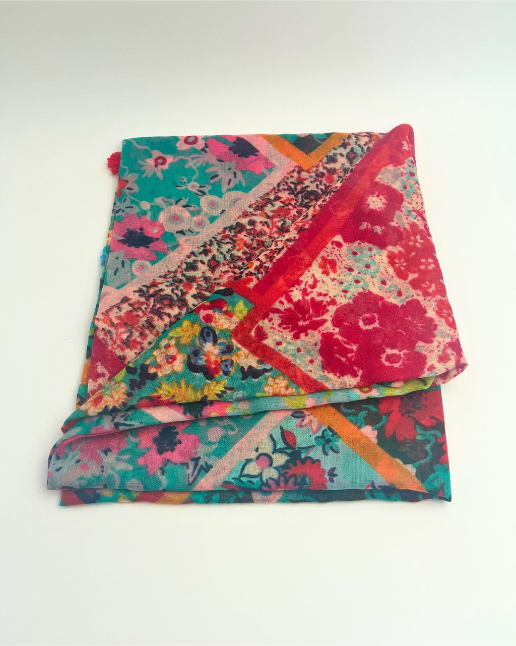 Add a pop of colour to any outfit with this colourful scarf or sarong, lightweight and versatile for year-round wear. Perfect for gifting, beach days, travel, or styling multiple ways as a scarf, wrap, or sarong.