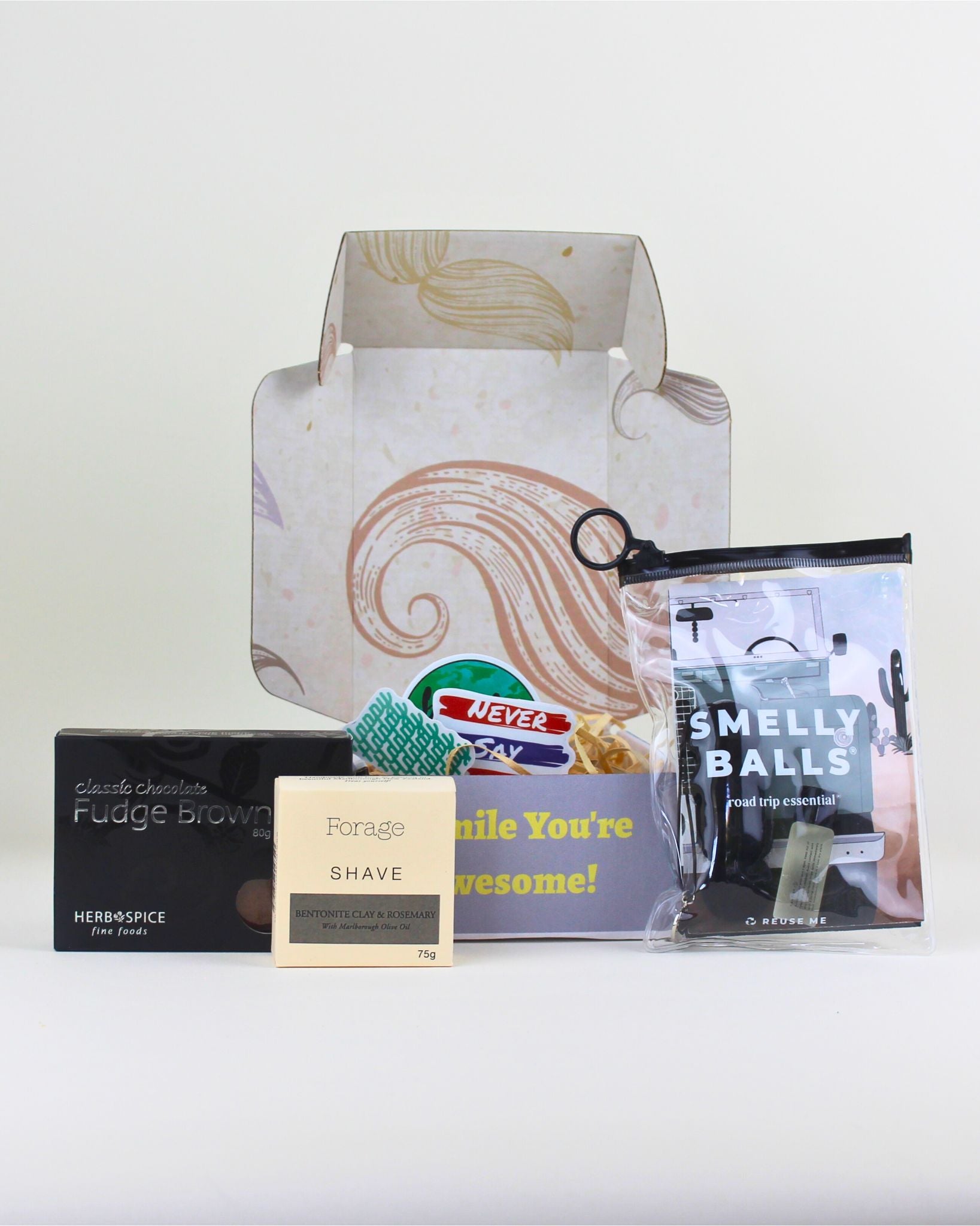 A fun small gift box for him featuring Smelly Balls car air freshener, NZ-made shave bar, chocolate brownie and a personalised card in a moustache box.