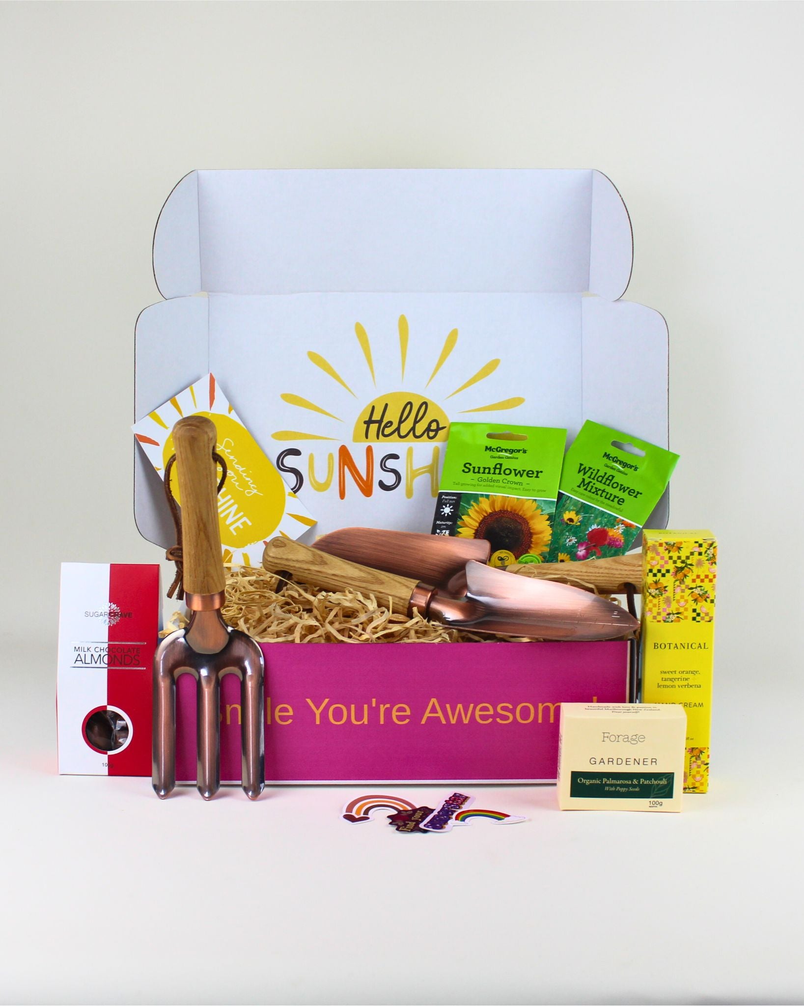 Blossom Bundle gift box with copper garden tools, hand cream, wildflower seeds, and chocolate almonds.