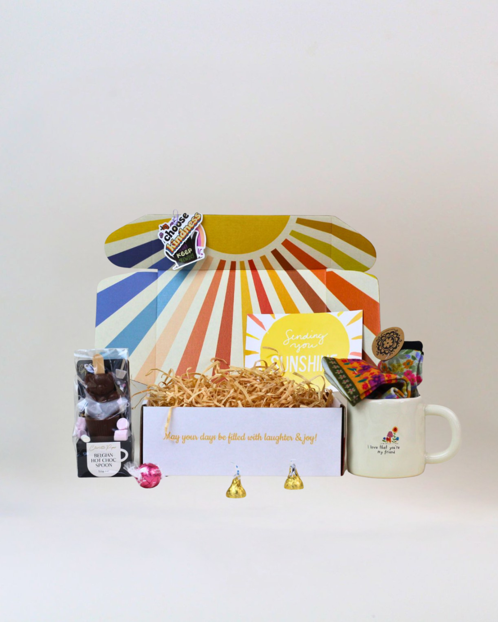 I Love That You're My Friend gift box with friendship mug, floral socks, hot chocolate spoon, Lindor chocolate and Hershey's Kisses.