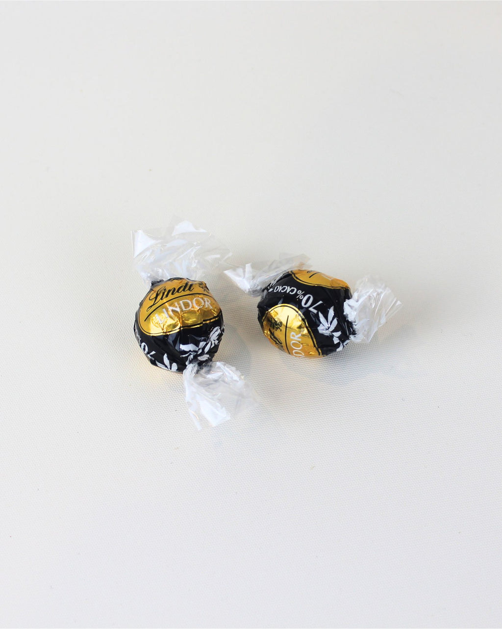 Savour the smooth, rich taste of Lindor Dark Chocolate Moments, New Zealand. Perfect for gifting, adding to a box, or enjoying a luxurious chocolate treat anytime.