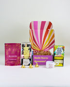 Mini friendship gift box with a friendship tealight candle, teddy bear hot chocolate spoon, trust your crazy ideas affirmations, and Wild Emery magnesium bath flakes.