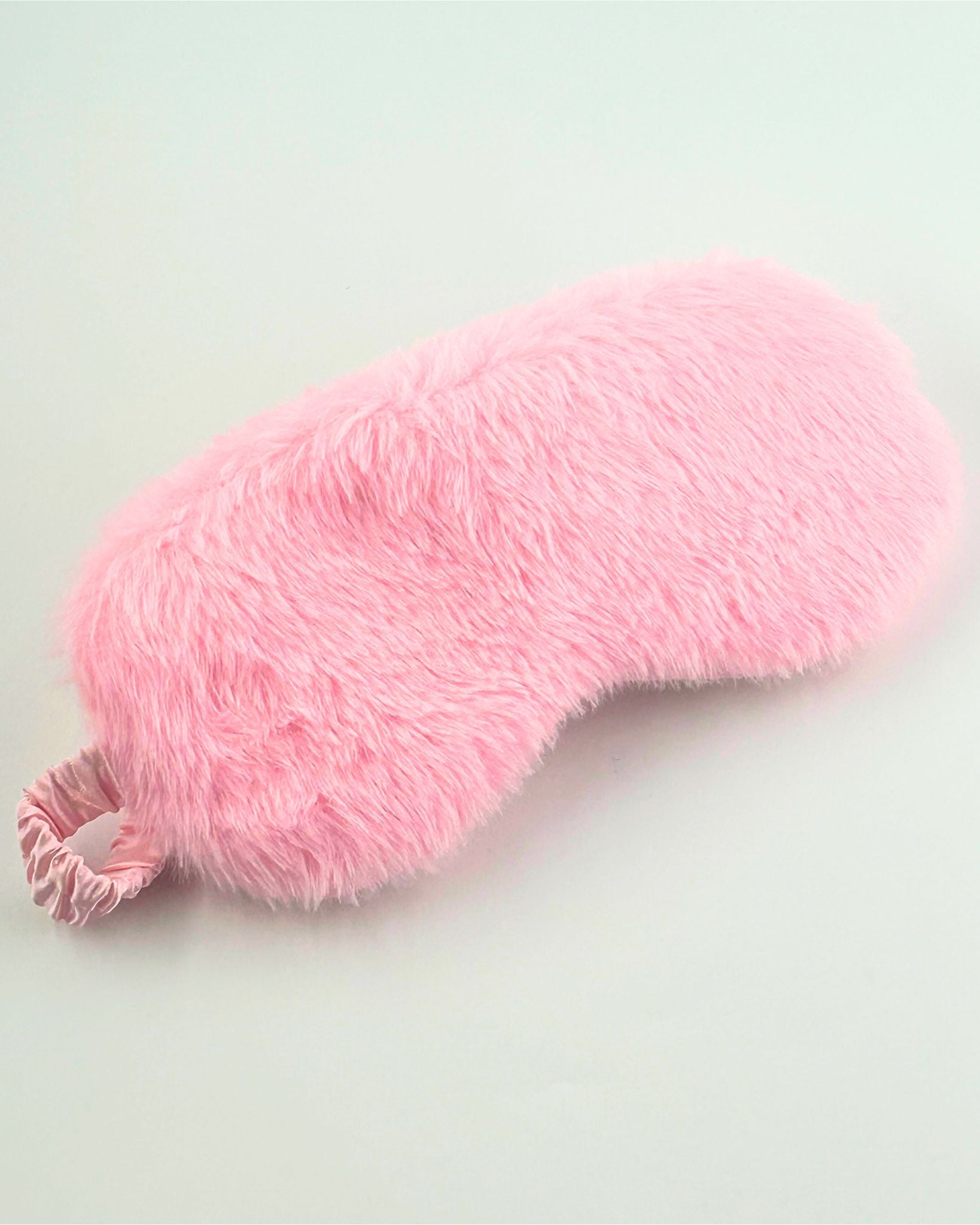 Enjoy ultimate comfort and relaxation with this luxury fluffy eye mask, perfect for blocking light during sleep, travel, or self-care rituals. A thoughtful gift or everyday wellness essential, made with soft, plush materials.