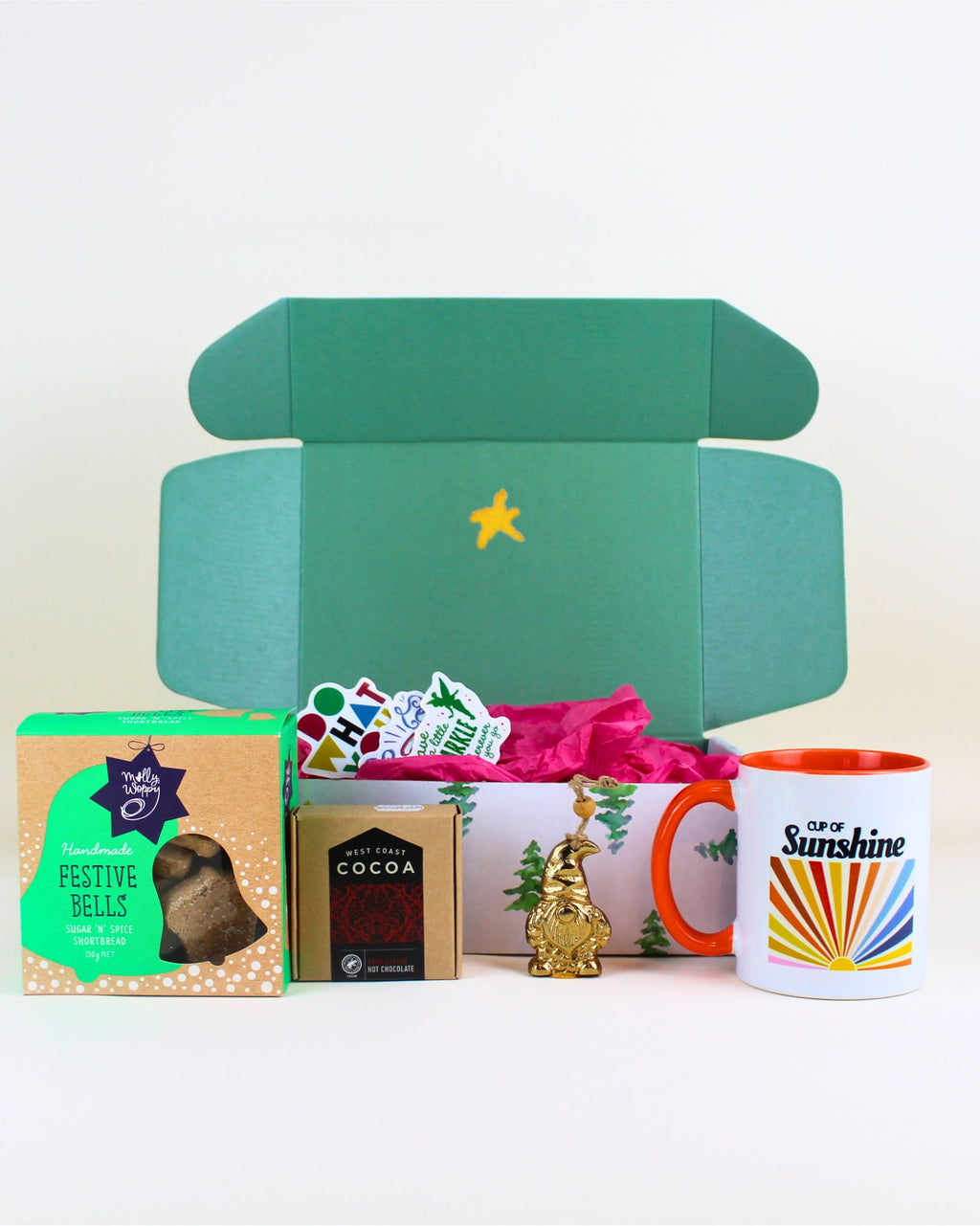 Merry & Bright Sunshine Christmas Box – includes a sunshine-in-a-mug cup, West Coast hot chocolate, and a brass Christmas tree keepsake. Perfect festive gift for Christmas hampers, gift boxes, and thoughtful seasonal presents NZ. Ideal for spreading joy and holiday cheer.