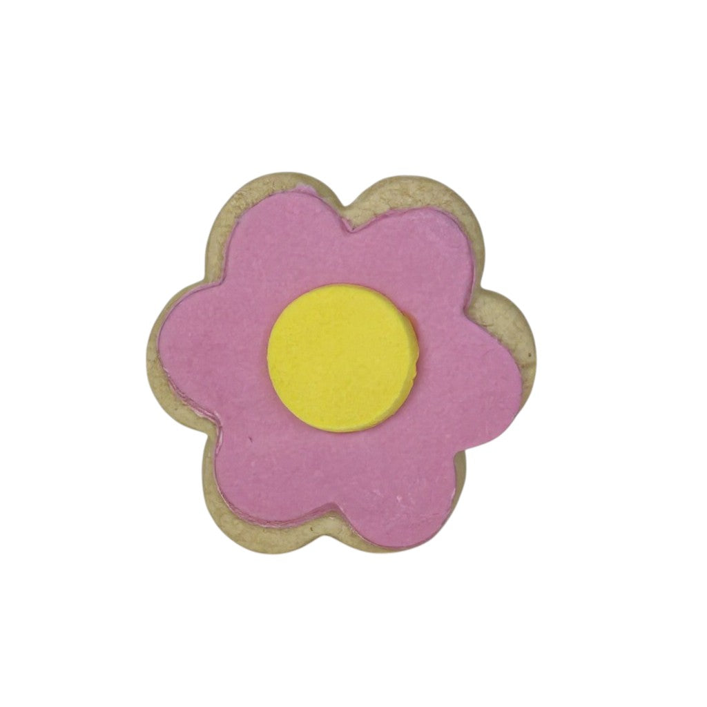“A pink Molly Woppy daisy cookie with a cute floral design, perfect as a sweet treat add-on for gift boxes, birthday hampers, or wellbeing packages.”