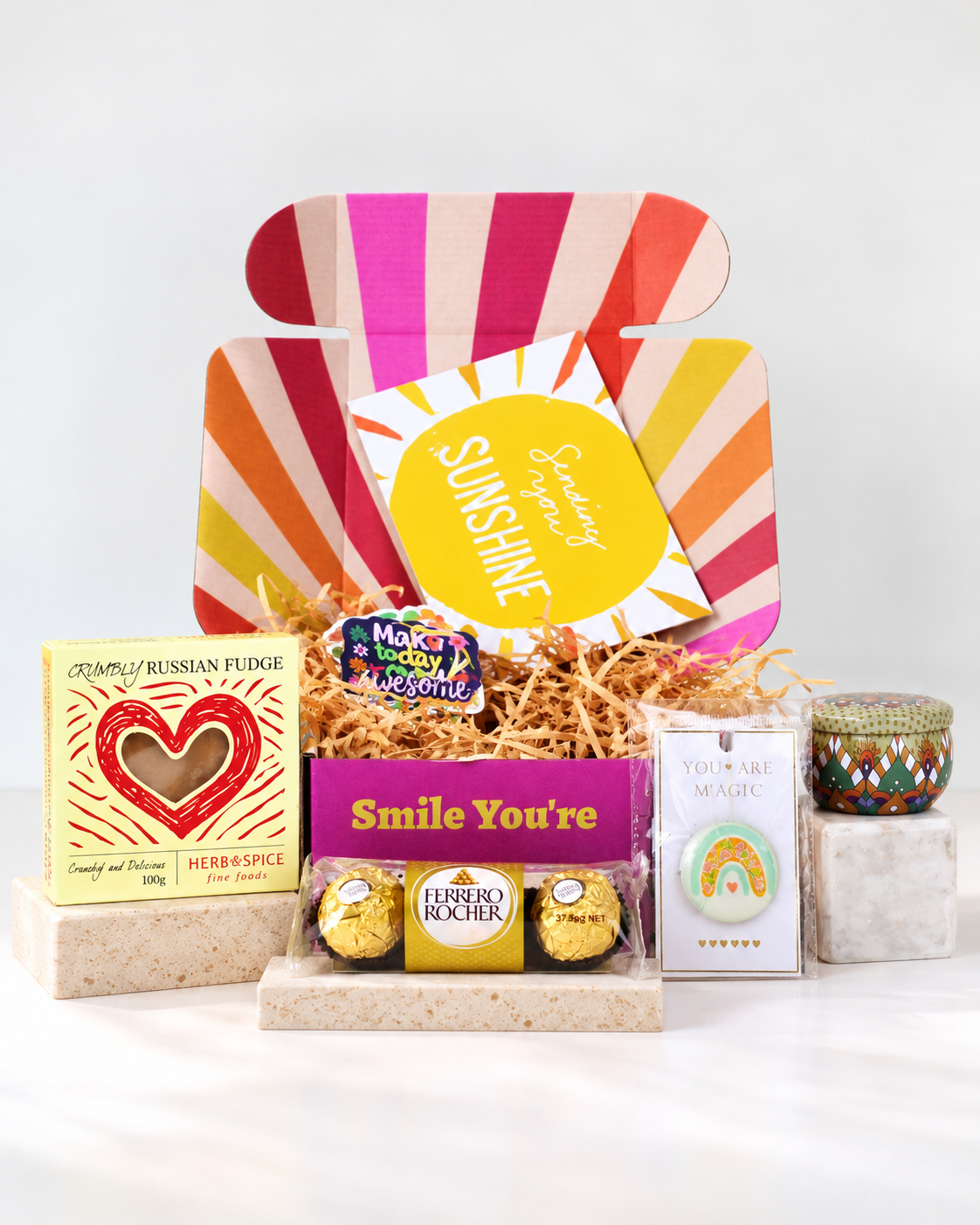 Petite Thinking of You Gift Box by A Box-Full featuring Herb & Spice Russian fudge, Ferrero Rocher chocolates, a colourful keepsake tin, rainbow keepsake and Sending You Sunshine card, presented in a bright, cheerful gift box.
 Copy