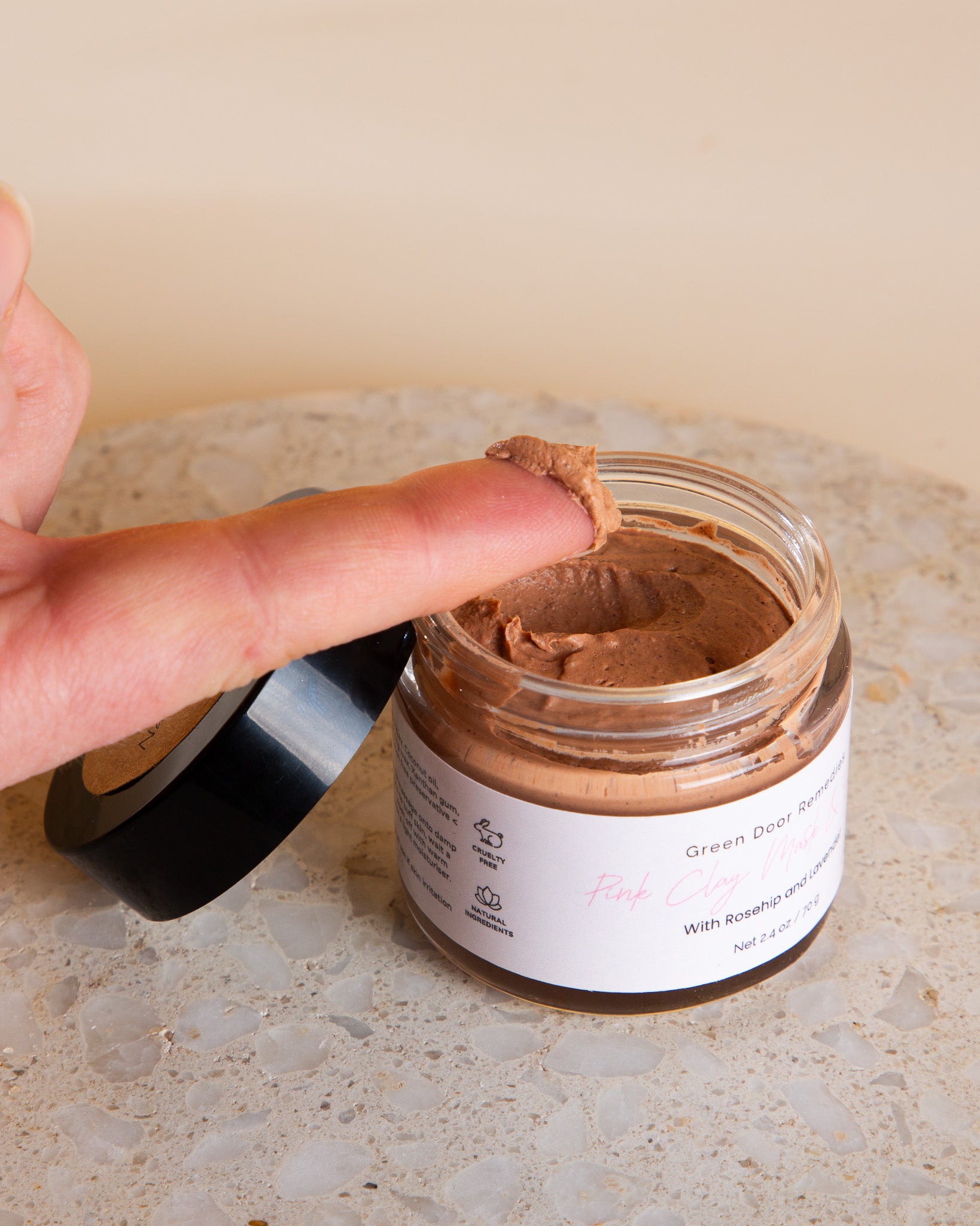 A soothing pink clay face mask and exfoliating scrub set, perfect for a relaxing wellness moment or a treat-yourself self-care ritual.