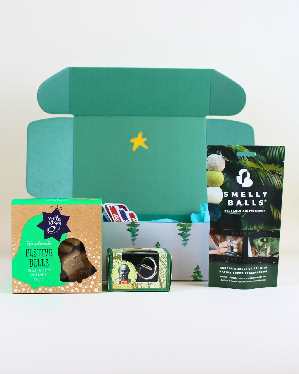 “Men’s Christmas gift box with Native Trees Smelly Balls air freshener, tinker puzzle and Molly Woppy cookies.”