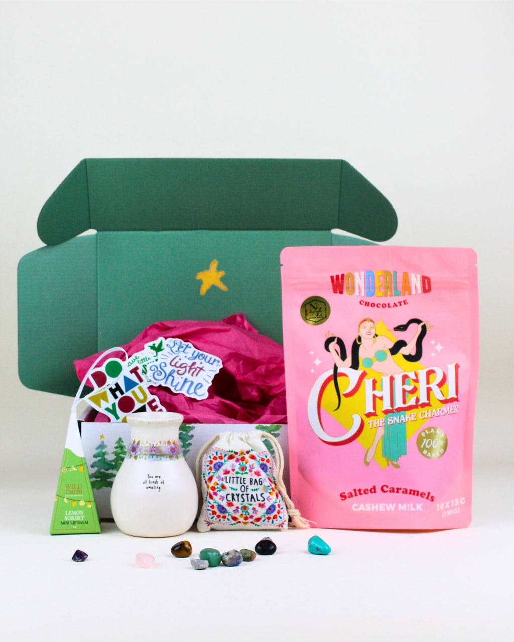 Celebrate someone special with The Festive Glow & Gratitude Christmas Box, featuring a festive-edition Lemon Sorbet Lip Gloss, an inspirational bud vase, gourmet salted caramel chews, and a bag of mixed crystals. A sweet, uplifting, and meaningful Christmas gift.