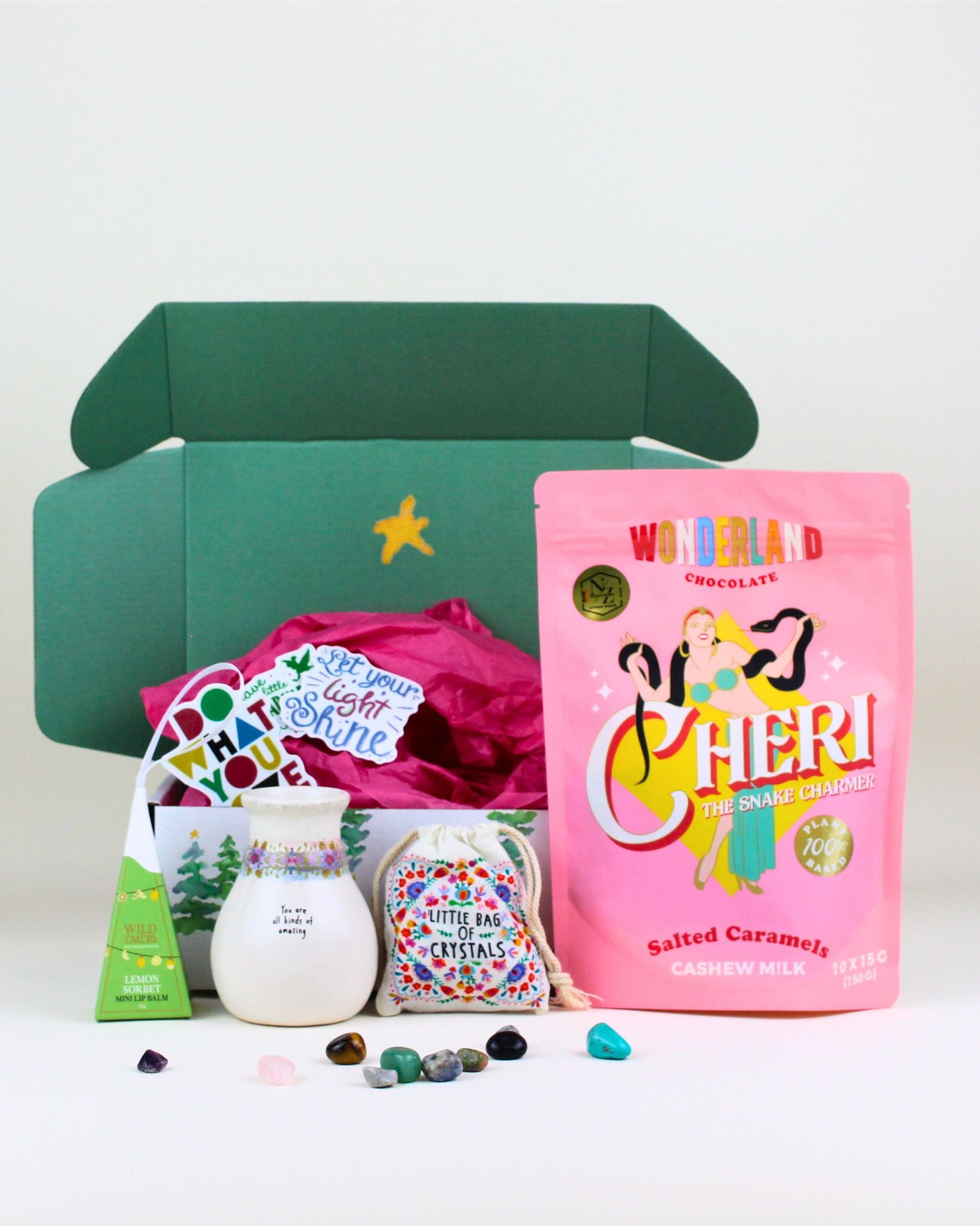 Celebrate someone special with The Festive Glow & Gratitude Christmas Box, featuring a festive-edition Lemon Sorbet Lip Gloss, an inspirational bud vase, gourmet salted caramel chews, and a bag of mixed crystals. A sweet, uplifting, and meaningful Christmas gift.