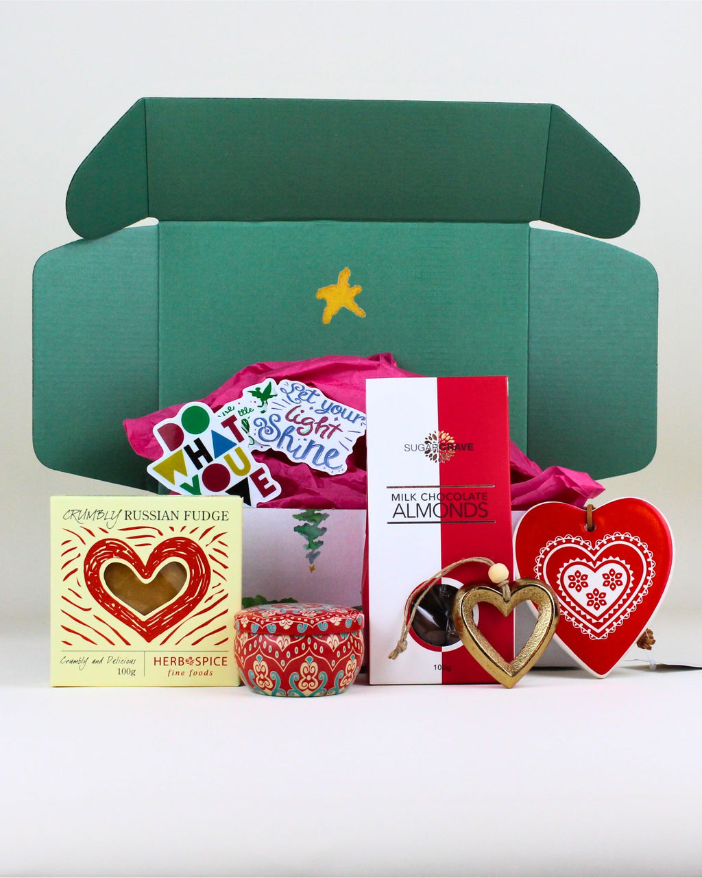 Celebrate the season with The Festive Indulgence & Keepsake Christmas Box, featuring decadent Russian fudge, your choice of festive chocolates, a mandala candle, brass Christmas tree keepsake, and a ceramic Merry Christmas heart. A beautiful mix of luxury, sweetness, and heartfelt sentiment.