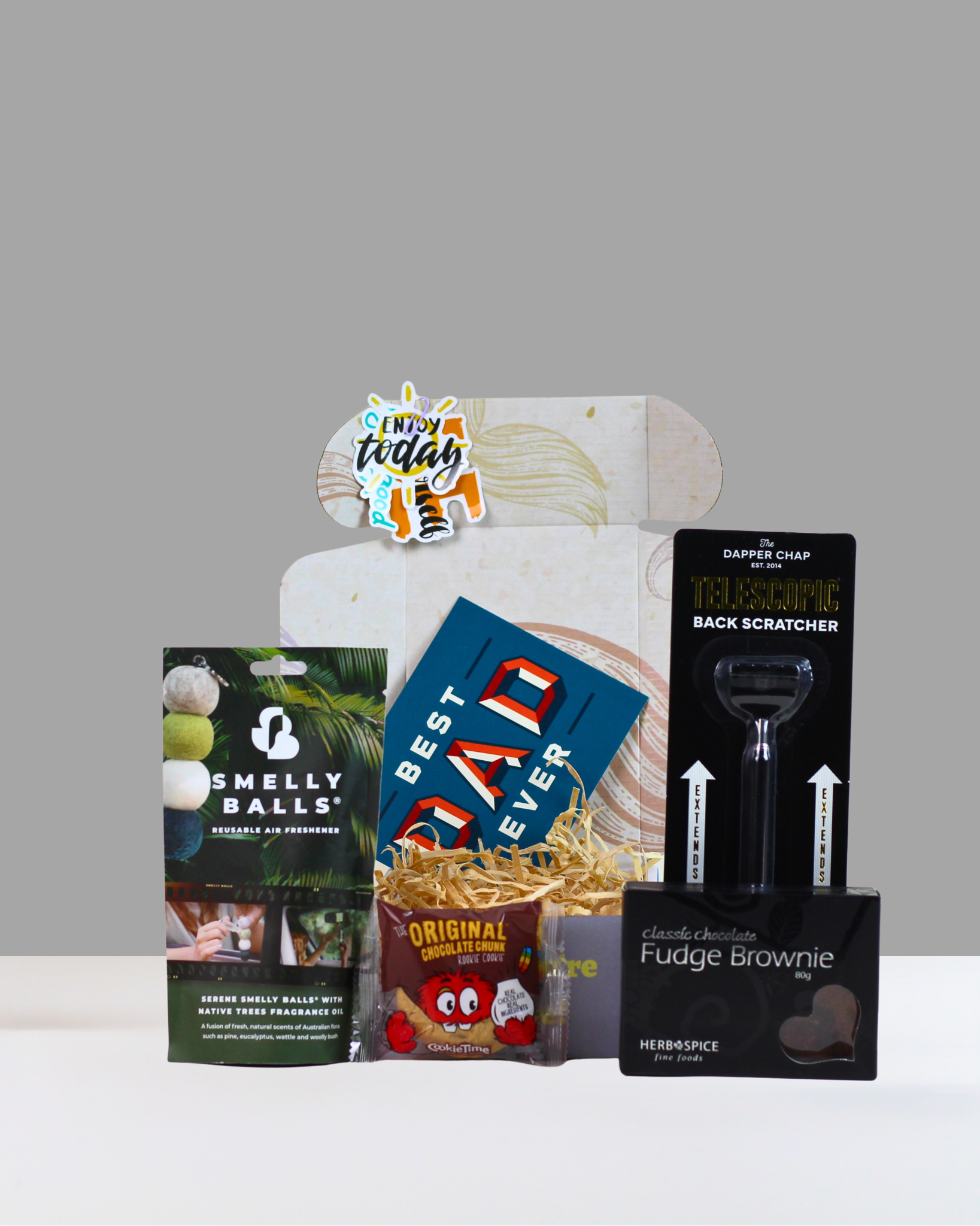 The Good Sort Gift Box NZ featuring Smelly Balls, Cookie Time cookie, brownie, back scratcher and personalised card in A Box-Full's signature moustache gift box.