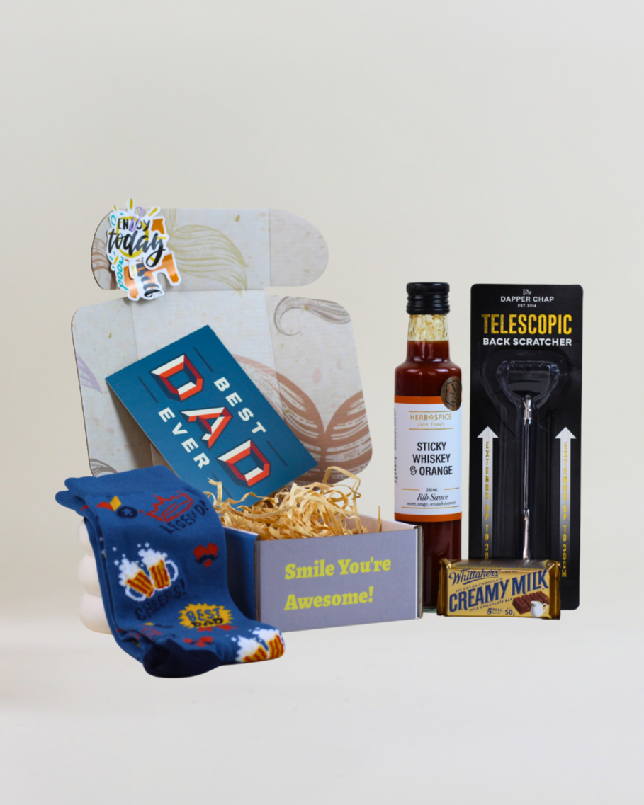 Top Dad Gift Box featuring Bamboozld bamboo socks, Herb & Spice Fine Foods Sticky Whisky & Orange Rib Sauce, telescopic back scratcher, Whittaker's creamy milk chocolate and gift card in A Box-Full signature gift box.

