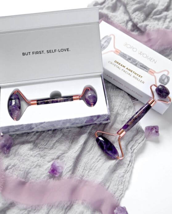 Wellbeing gift NZ natural amethyst facial roller by Bopo Women designed to boost circulation and enhance serum absorption.