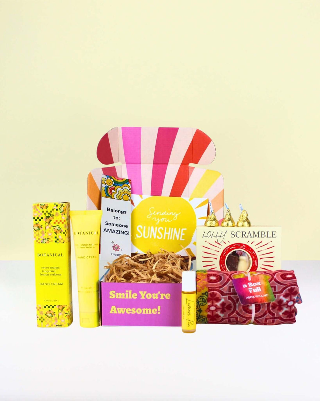 Thoughtful Gift Box NZ Little Box of Sunshine with Botanical hand cream, lemon essential oil roller, kiwi lolly scramble, and cheerful scarf gift set