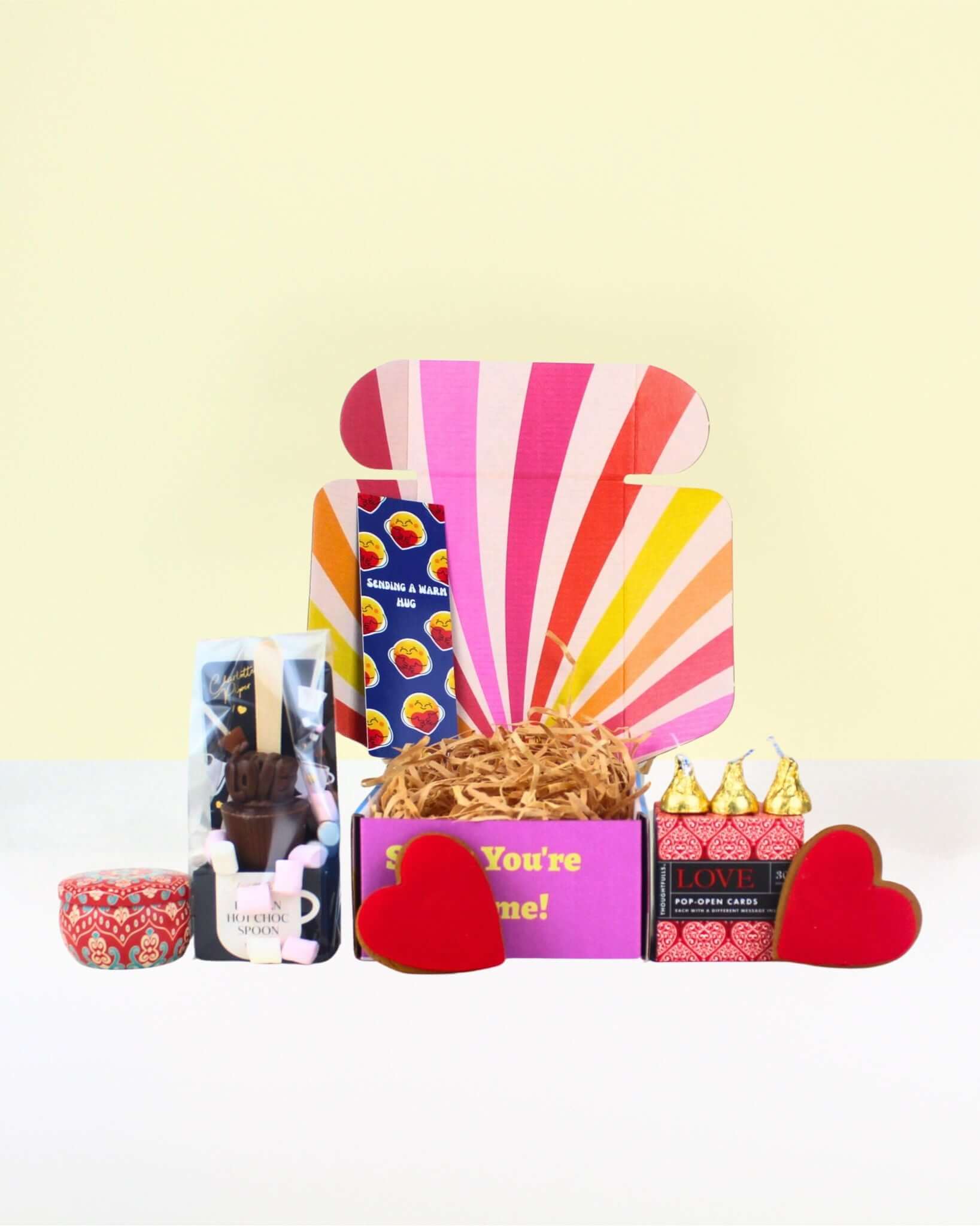 Affordable Gift Box NZ featuring a colourful box filled with treats and heartfelt gifts, petite box full of love. 