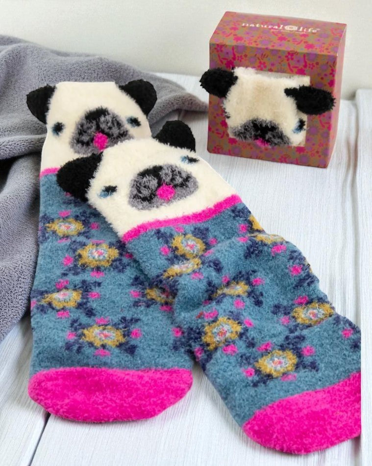Pair of puppy-themed socks with a matching box on a white surface