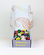 Fun Lollies Gift Box NZ – playful moustache-themed hamper with 500g of chewy lollies, personalised card included, NZ-wide delivery for birthdays or thank-yous.
