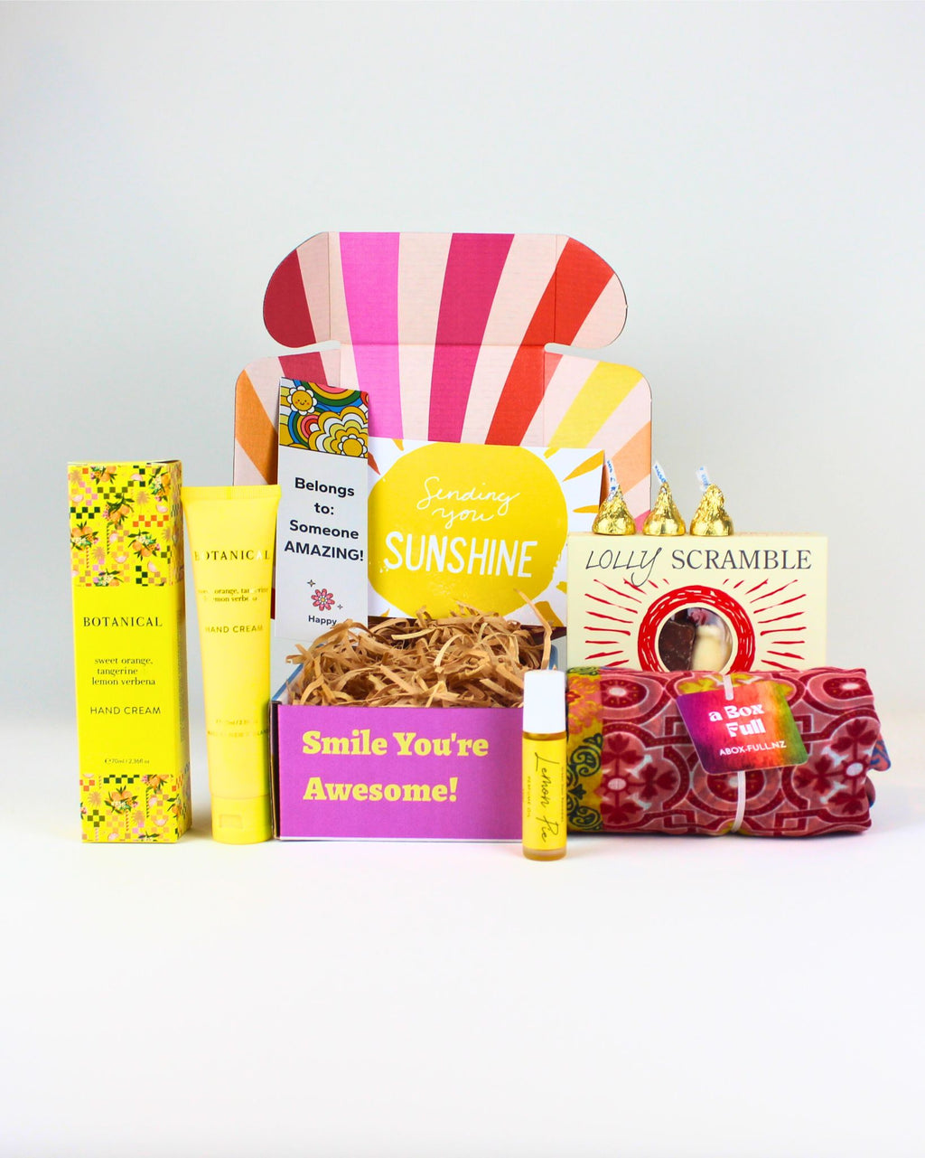 The Little Box of Sunshine NZ – cheerful gift box with treats, hand cream, essential oil roller, scarf or sarong, and personalised card, perfect for birthdays or thank-yous.
