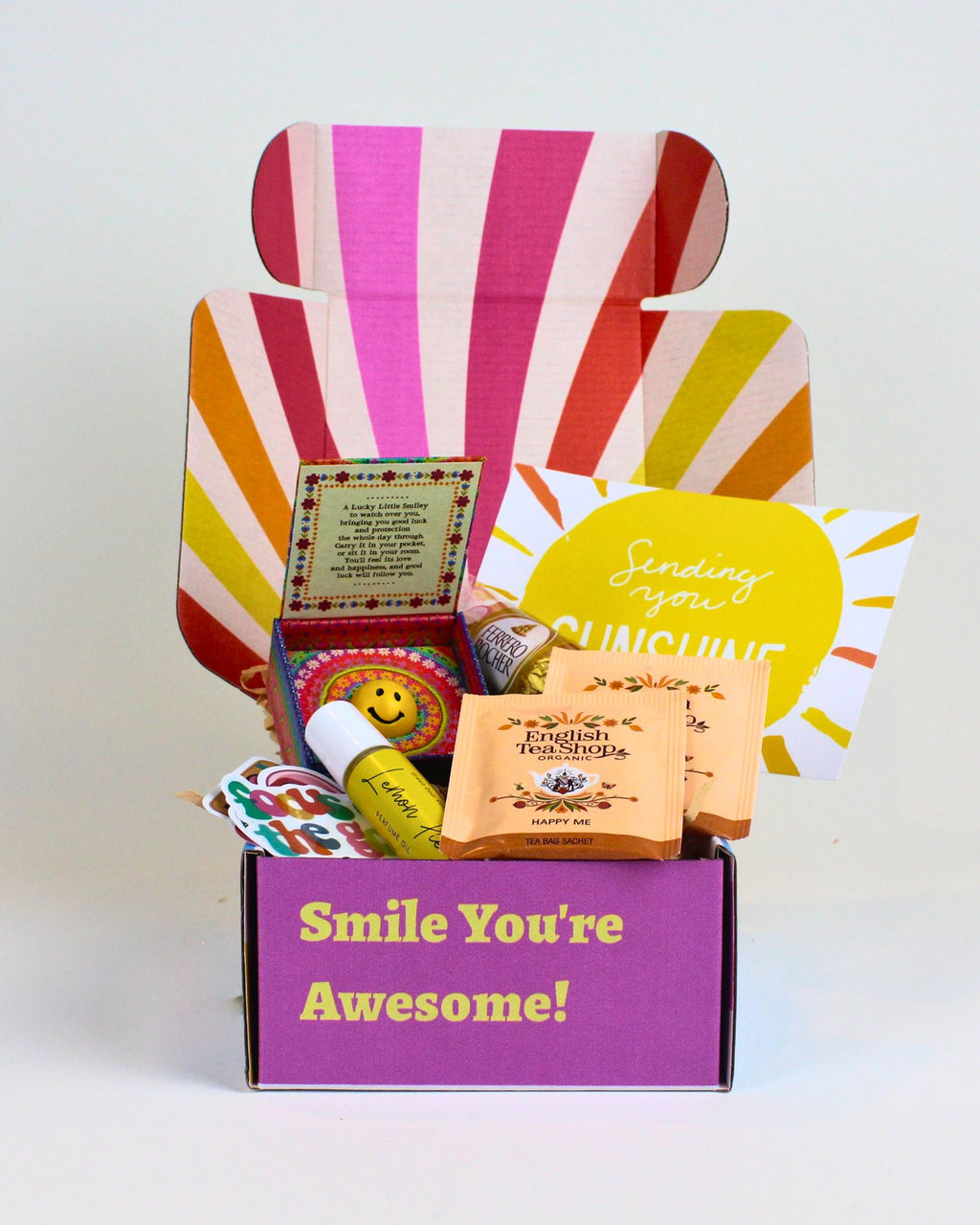 Petite Lucky Charm Smile Box NZ – fun and meaningful gift packed with delightful goodies, luck-bringing charm, and personalised card, ready for NZ-wide delivery.
