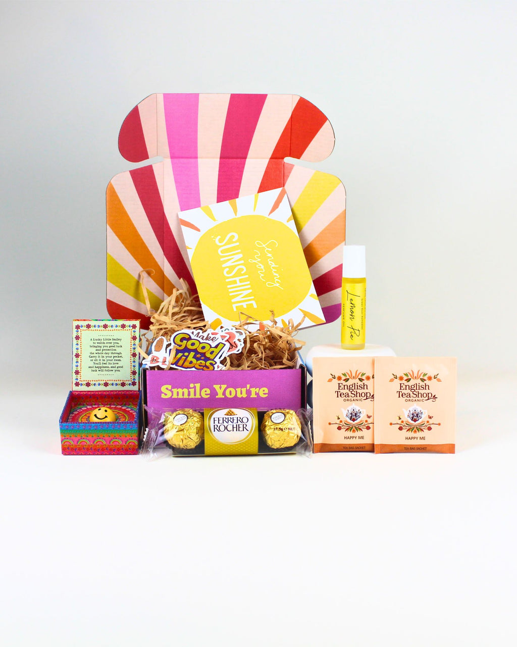 Petite Lucky Charm Smile Box NZ – fun and meaningful gift packed with delightful goodies, luck-bringing charm, and personalised card, ready for NZ-wide delivery.
