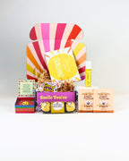 Petite Lucky Charm Smile Box NZ – fun and meaningful gift packed with delightful goodies, luck-bringing charm, and personalised card, ready for NZ-wide delivery.
